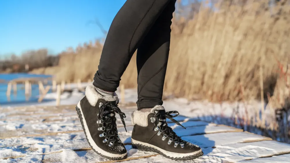 woman in tights and sneakers in winter.